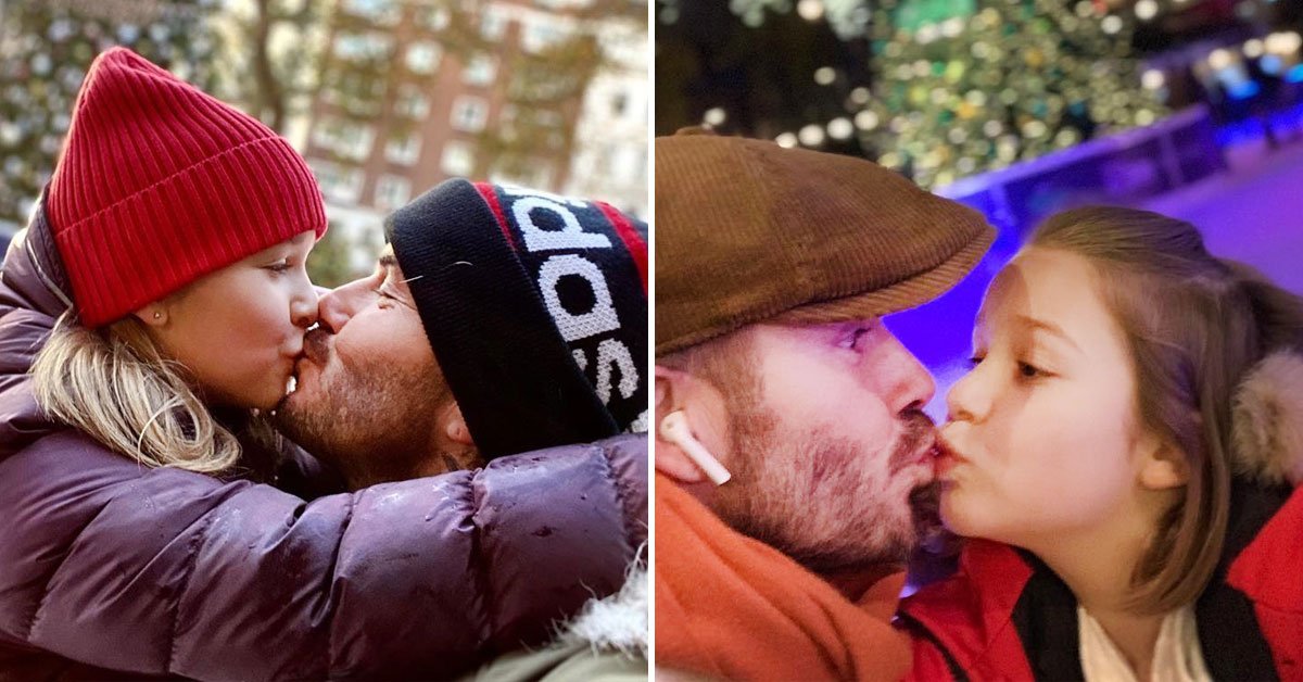 папа целует дочь